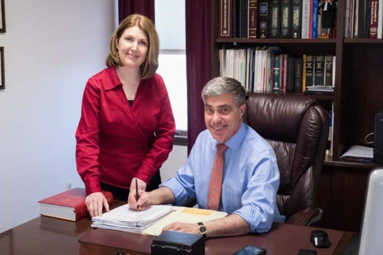 Lawyer and paralegal working at a desk